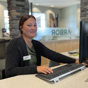 Dana Cubbage shown at the teller line at Arbor Financial's Gaines Township office.